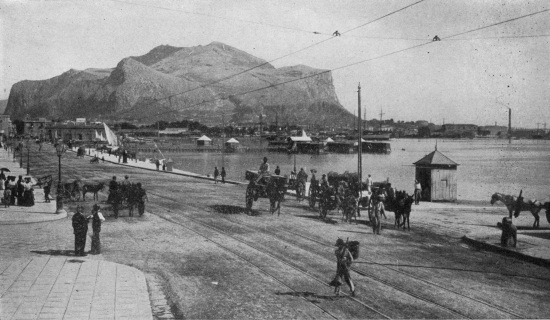 Monte Pellegrino looms square and massive at one tip of
Palermo’s crescent harbor.