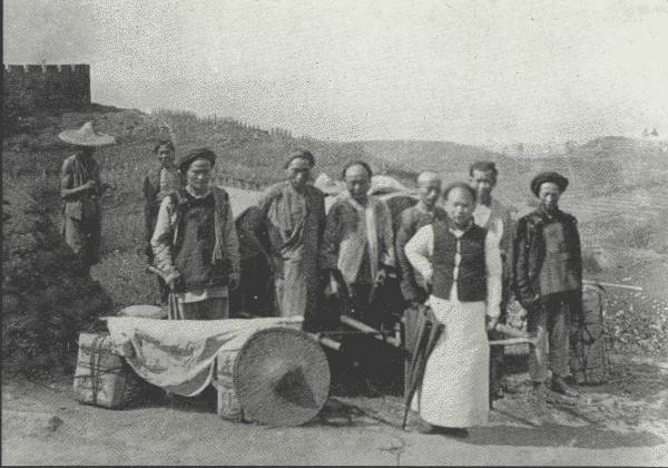 AUTHOR'S MODEST CARAVAN IN SZECH'UAN

And a fine body of men they were, kept in order by the general factotum
in the foreground—each of them earning about 25 cents a day.