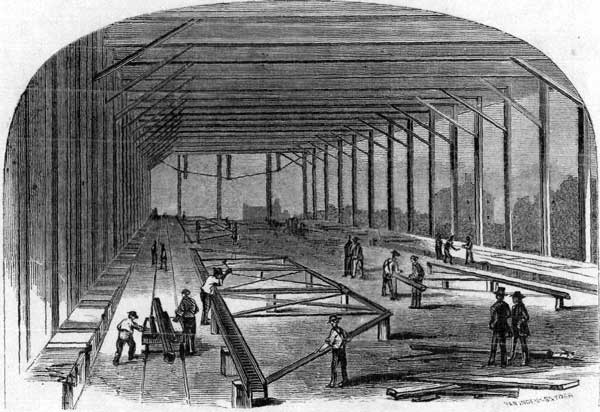 "ASSEMBLING" BRIDGE UNDER SHED.—p. 22.