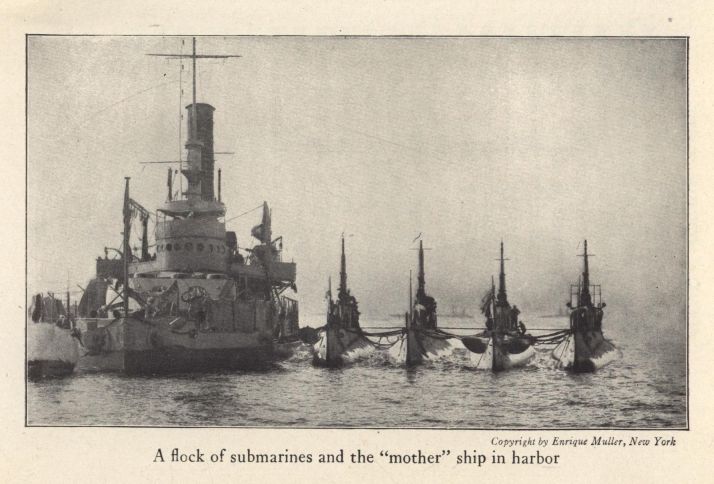 A flock of submarines and the "mother" ship in harbor