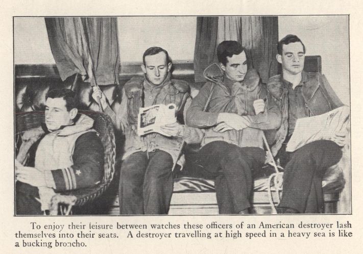 To enjoy their leisure between watches these officers of an American destroyer lash themselves into their seats.  A destroyer travelling at high speed in a heavy sea is like a bucking broncho.