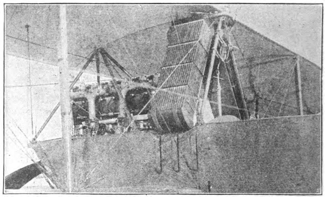 A Motor Installation in a Pusher Type Biplane, Showing the Motor at the Rear and the Double Radiator Sections Over the Body.