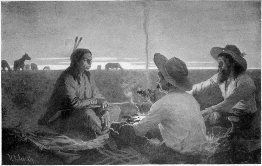 Three men sit on the ground around a campfire with one a Native
American. It is near sunset and there are horses in the background.