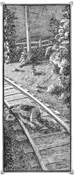 Man lying on railway track