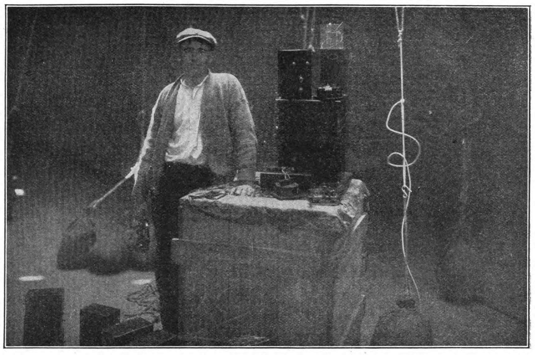 FIG. 113.—Operator Jack Irwin overhauling the wireless apparatus for the dirigible balloon "America."