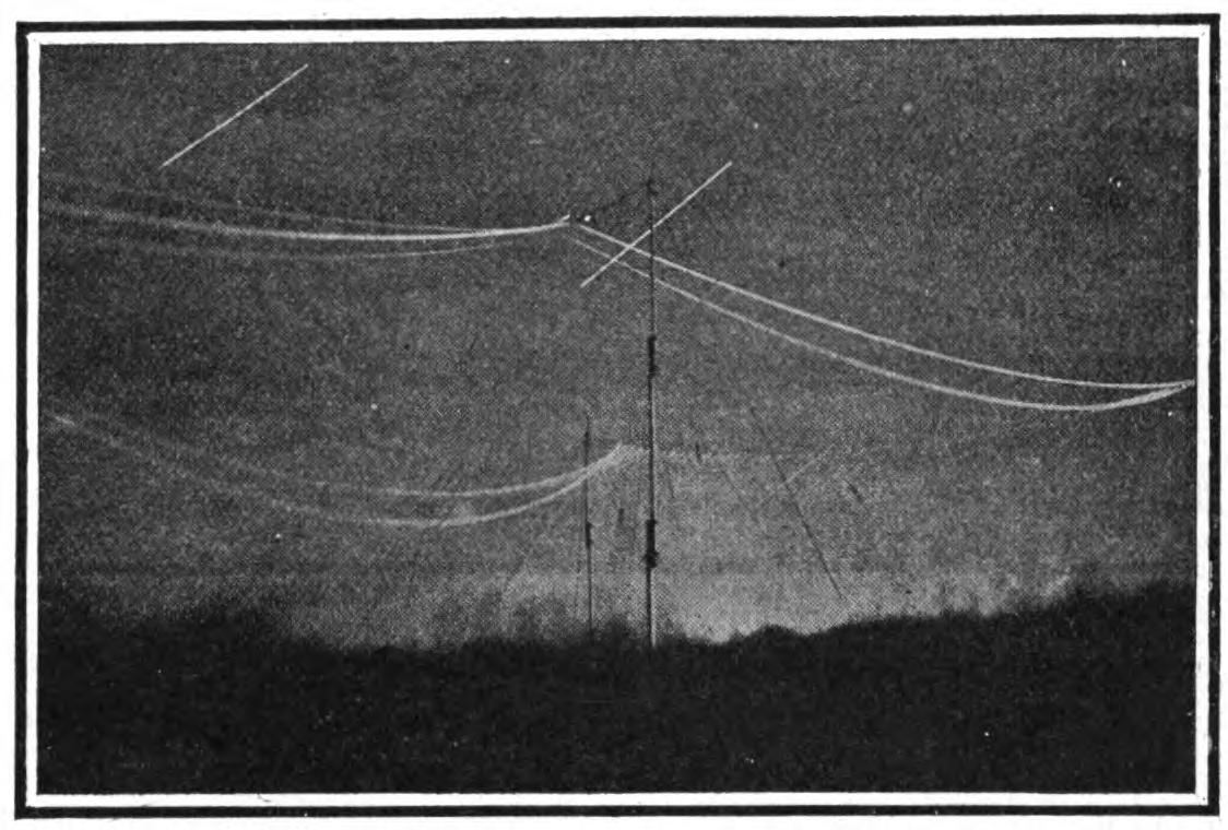 FIG. 149.—Showing the brush discharge from a Marconi transatlantic aerial at night.