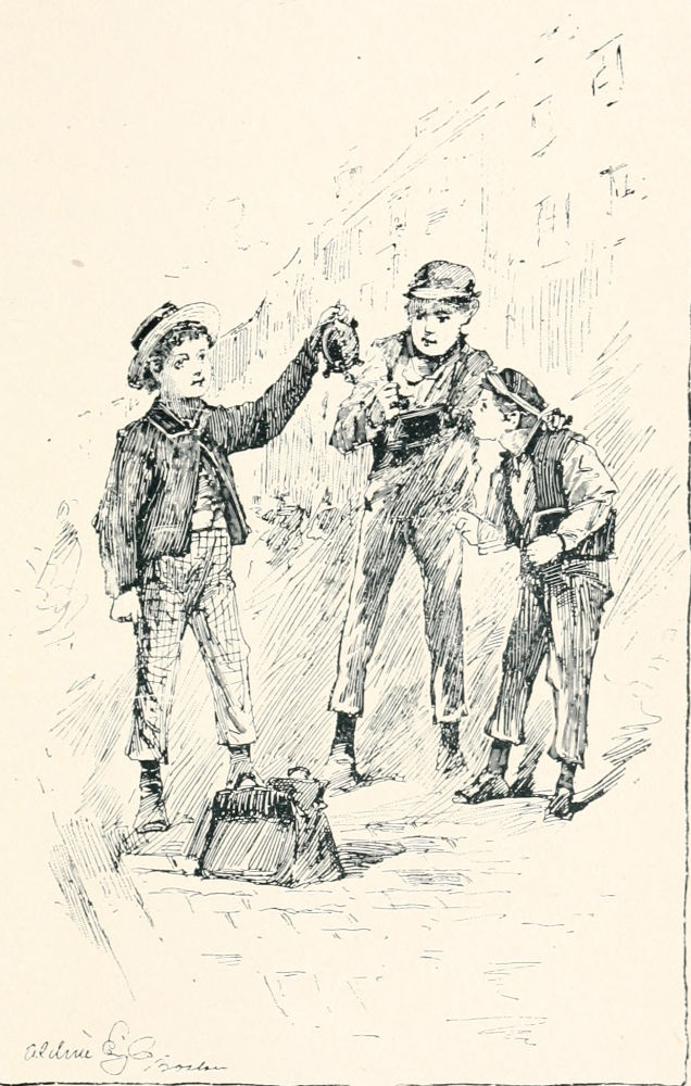 Three boys pulling something out of a valise