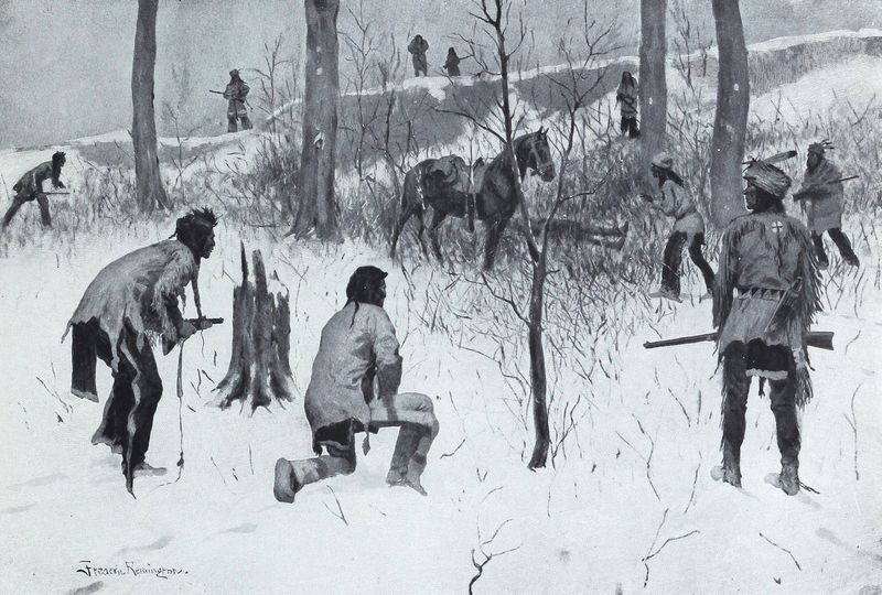 Hunting group examining tracks on the snowy ground